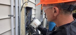 electrician servicing meter